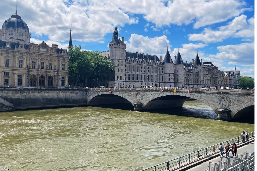 The medieval Conciergerie, a former royal palace and prison, with its striking towers along the Seine River