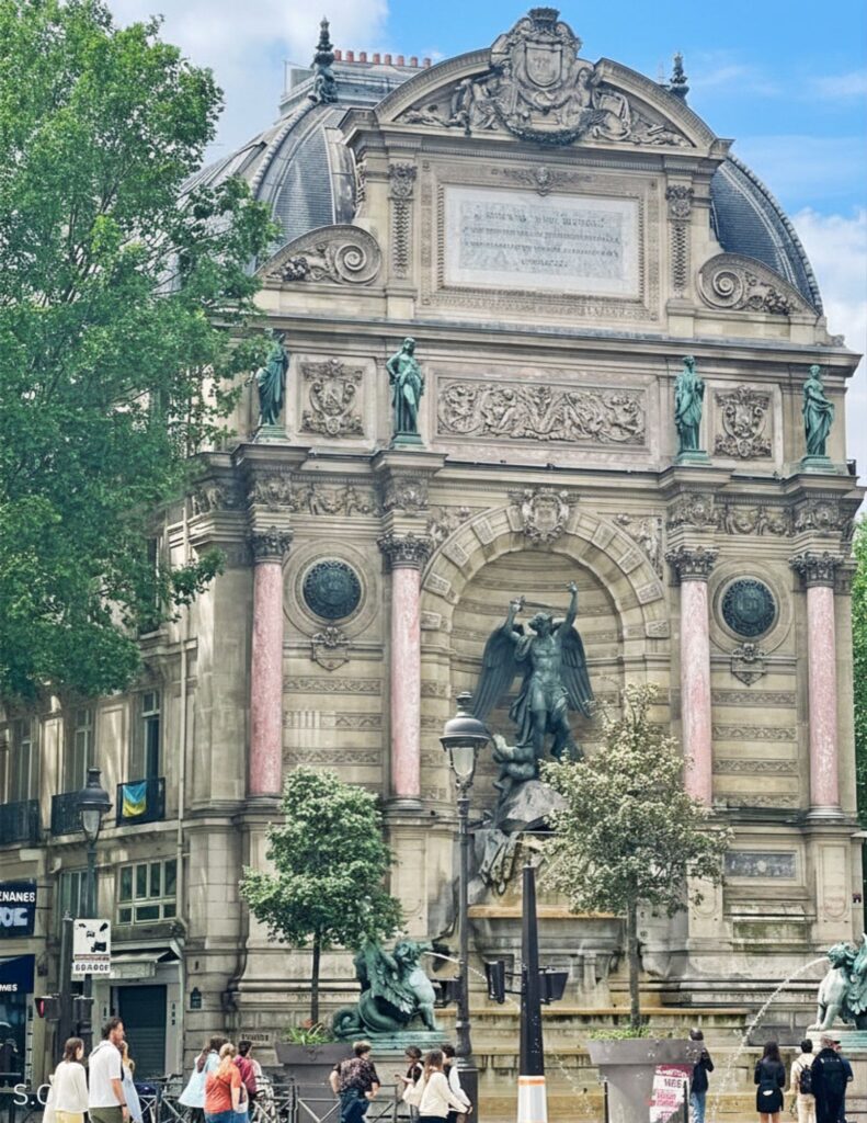 The ornate Fontaine de Saint-Michel, depicting Saint Michael 