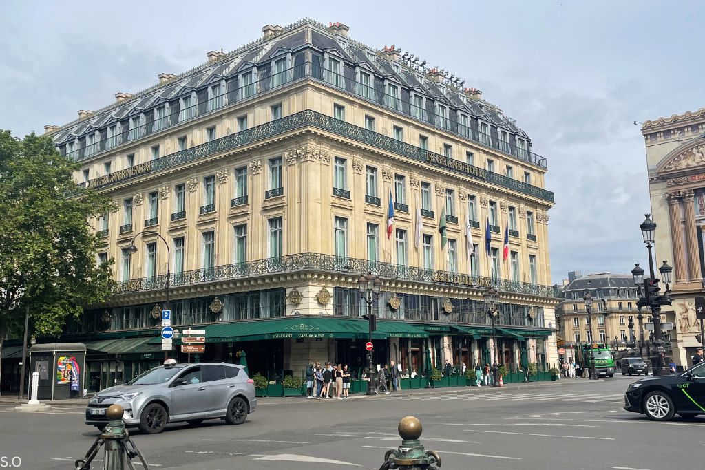 Café de la Paix with ornate Opéra district architecture, outdoor tables, and a historic Paris atmosphere.