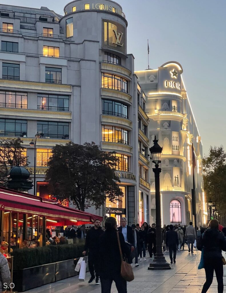 Champs-Élysées in Paris with elegant YSL and Dior storefronts