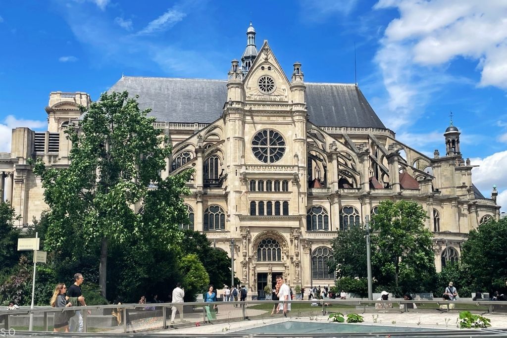 Église Saint-Eustache in Paris with towering Gothic architecture and a historic church façade.